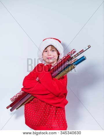 Charming Boy Wearing Santa's Hat In Red Sweater