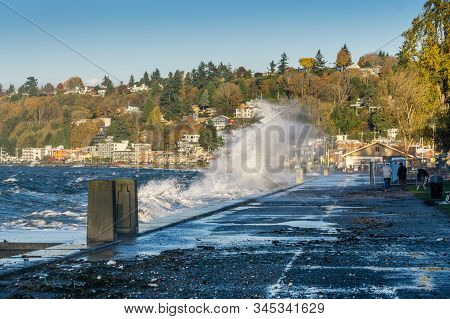 Waves Crash Onto The Shore At Alki Beach In West Seattle, Washington.
