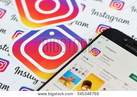 Instagram App On Samsung Smartphone Screen On Banner With Small Instagram Logos. Instagram Is Americ