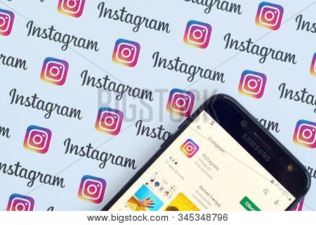 Instagram App On Samsung Smartphone Screen On Banner With Small Instagram Logos. Instagram Is Americ