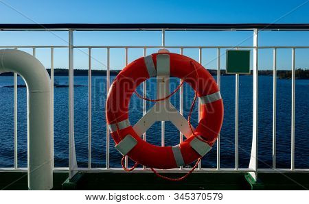 Lifebuoy On The Railing Of One Of The Decks Of A Tourist Ferry