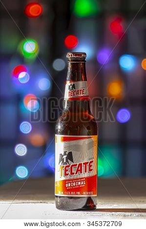 Calgary Alberta Canada. Jan 23 2020. A Bottle Of Tecate Beer. A Mexican Beer On A White Texture Surf