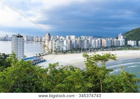Coastal City With Many Tall Buildings Near To The Beach. Aerial View Of Sao Vicente City, Sp Brazil.