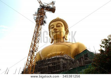 Bangkok , Thailand - January 13 , 2020 : The Large Outdoor Golden Sitting Buddha Is Phra Buddha Dham