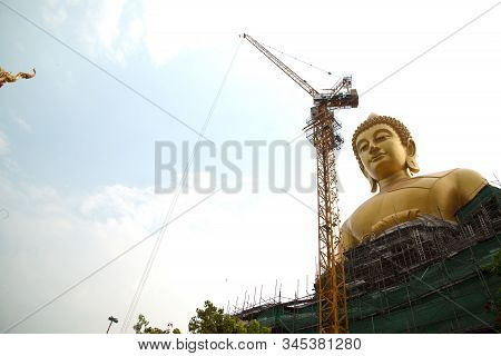 Bangkok , Thailand - January 13 , 2020 : The Large Outdoor Golden Sitting Buddha Is Phra Buddha Dham