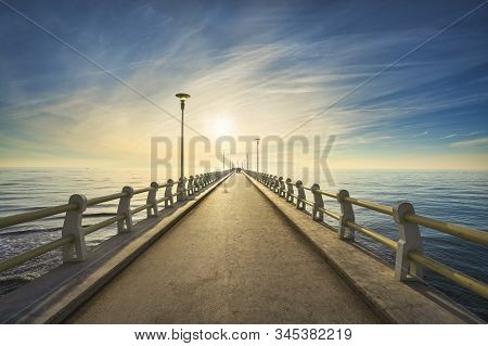 Pier Or Jetty, Footpath Promenade And Sea In Forte Dei Marmi At Sunset. Versilia Lucca Tuscany Italy