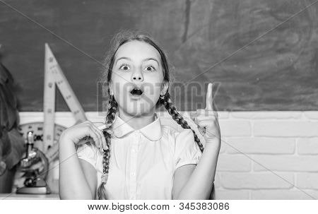 Girl Cute Child Sit School Classroom Chalkboard Background. Small Kid Study School. Knowledge Day. H