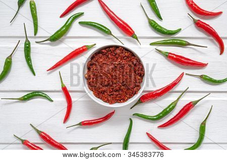 Hot Chili Pepper Paste. Red Sauce On White Background. Adjika Or Ajika In Georgian Cuisine Or Hariss