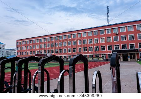 China, Heihe, July 2019: School Building, Streets Of The Chinese City Of Heihe In The Summer