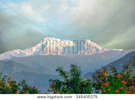 A Beautiful Machhapuchhre Mountain With Clouds Of Pokhara Nepal. Clicking At Morning.