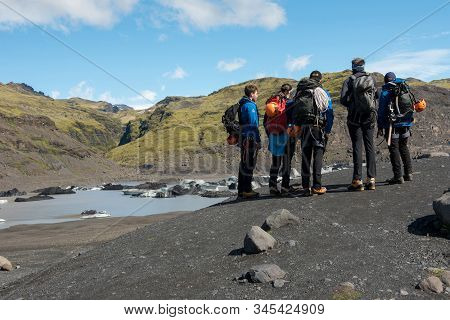 Tourists Hiking At Solheimajokull Glacier, Iceland