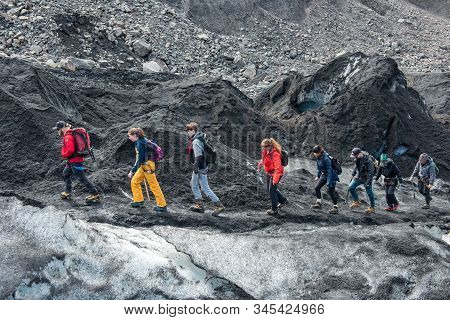 Tourists Hiking At Solheimajokull Glacier, Iceland