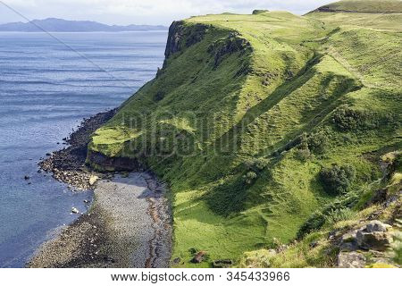 Inver Tote Beach With Dun Grianan Fort Top Right With Rona & Raasay In Distance