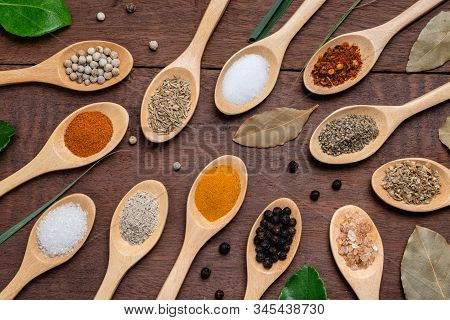 Various Spices In Wooden Spoon On Wood Table Background, Sugar, Pepper, Salt, Turmeric, Rosemary, Or