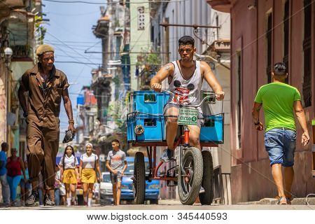 Havana, Cuba - May 16, 2019: Bicycle Taxi Driver In The Street Of Old Havana City During A Vibrant A