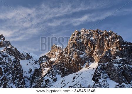 Snow Rocky Mountains At Sunrise With Blue Sky In Kazakhstan