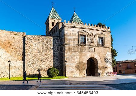 Toledo, Spain - December 6, 2019: The New Bisagra Gate In The Ramparts. View Against Blue Sky. It Wa