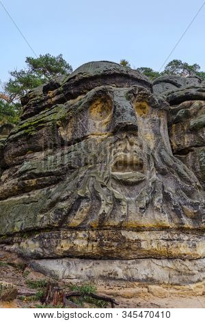 Sculptures Devil's heads in the village Zelizy - Czech republic - travel and architecture background