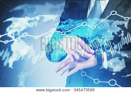 Close Up Of Businessman Checking His Watch Over Blue Background With Double Exposure Of World Map In