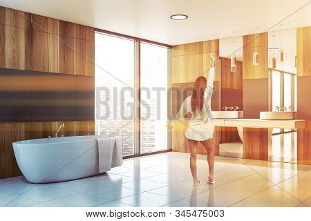 Young Girl In Gray And Wood Bathroom Corner