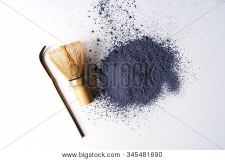 Heap Of Matcha Blue Tea Powder And Bamboo Chasen Isolated On White Background, View From Above.