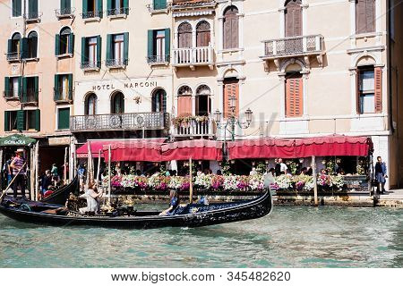 Venice, Italy - September 24, 2019: Gondolas With Tourists Floating Near Hotel Marconi In Venice, It