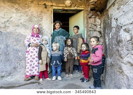 Berber Grandmother Taking Care Of Many Kids In Front Of Her House