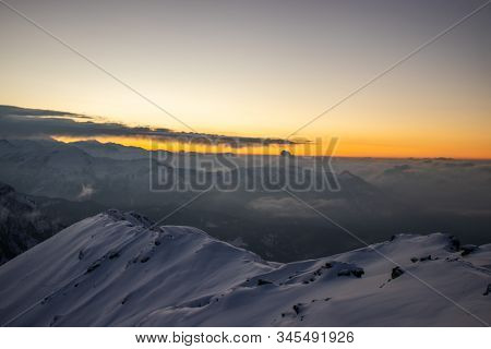 A Beautiful View Of A Sunrise And Himalayan Mountain Range From The Summit Of A Himalayan Mountain