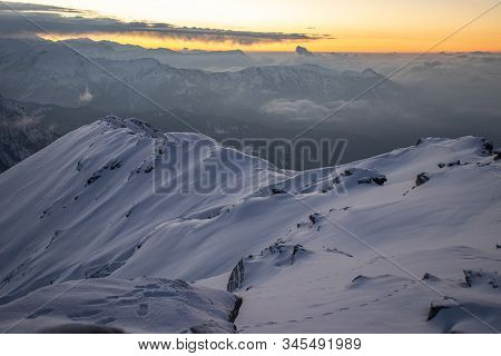 A Beautiful View Of A Sunrise And Himalayan Mountain Range From The Summit Of A Himalayan Mountain