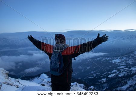 A Mountaineer Or Hiker Enjoying A View Of Himalayan Mountains From The Summit Of Mountain