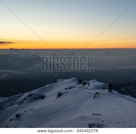 A View Of A Sunrise From The Summit