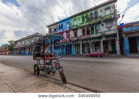 Havana, Cuba - May 14, 2019: Bicycle Taxi Driver Riding In The Streets Of Old Havana City During A V