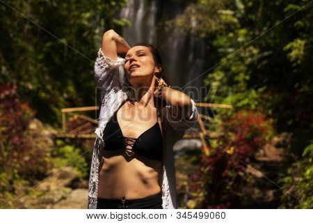 Woman near Labuhan Kebo Waterfall located in Munduk, Bali