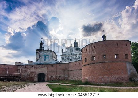 Carmelite Monastery Walls And Dramatic Sky In Berdychev; Zhytomyr Oblast, Ukraine