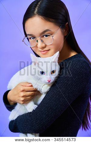 A Cat With A Different Eye Color, A Girl With Glasses Holds A White Cat, Bright Colours