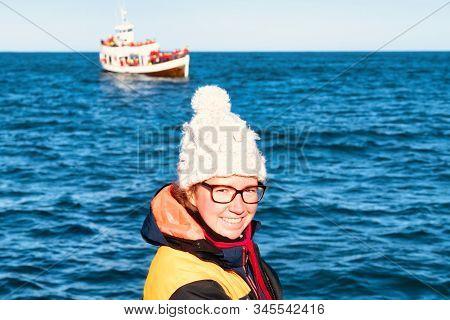 Husavik, Iceland A Young Girl Dressed As A Fisherman On A Boat To See Whales In Husavik
