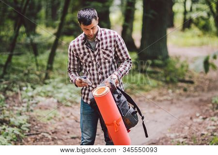 Guy With Backpack, Traveller, Hipster Standing In Woods, Hiking, Forest, Journey. Caucasian Tourist 