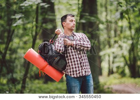 Guy With Backpack, Traveller, Hipster Standing In Woods, Hiking, Forest, Journey. Caucasian Tourist 
