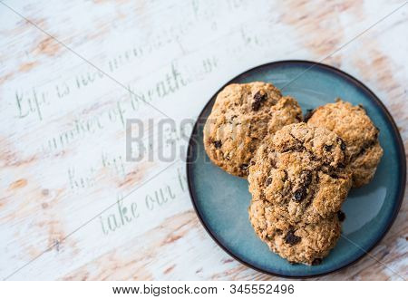 Fruit Scones - Freshly Baked Raisins And Cinnamon Scones On Vintage Plate