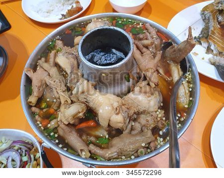Thai Food Style,top View Of Chicken Feet Spicy Soup In Hot Pot, Tom Sab Kha Kai Or Om Yum Super Is T