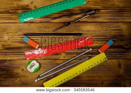 Set Of School Stationery Supplies On Wooden Desk. Top View
