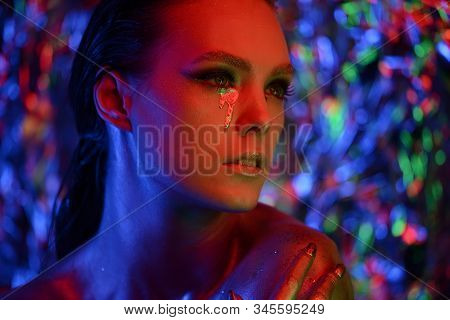 High Fashion Model Girl Portrait With Colorful Powder Make Up. Beauty Woman With Bright Color Makeup