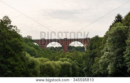 Elstertalbrucke Railway Brick Bridge Above Weisse Elster River With Trees Around Near Plauen City In