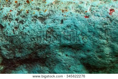 Old Painted Granite Stone Rock Background. Green, Cyan, Turquoise, Aquamarine.