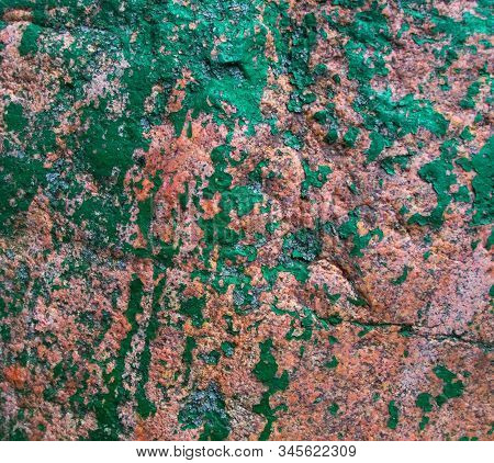 Old Painted Granite Stone Rock Background. Brown, Green, Pink. Red