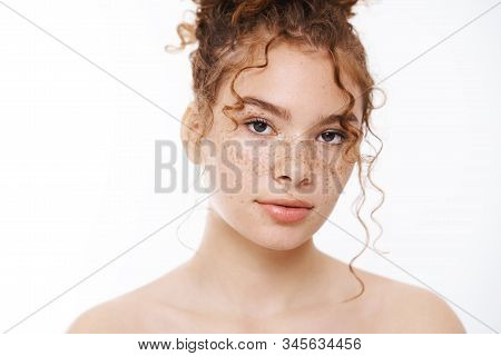 Beauty, Cosmetics Spa Recreation Concept. Close-up Naked Attractive Redhead Woman Freckles Standing 
