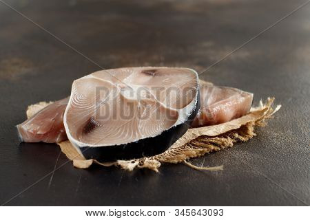 Two Shark Steak On A Dark Board Close Up