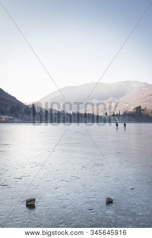 People Skating On The Endine Frozen Lake. Endine Gaiano (bg) Italy - January 22, 2019.