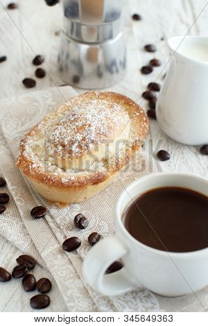 Cup Of Coffee With Pasticciotto Pastry On A Rustic Background Close Up