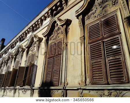 Beautiful Facade Of An Old Building In Serbia. Wooden Shutters Give The House A Special Charm. Windo